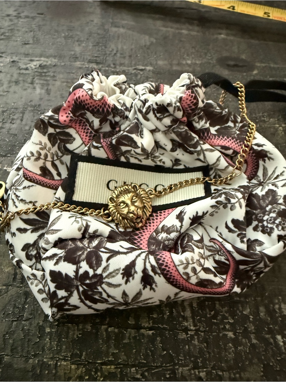 Gucci lion head bracelet with heart charm